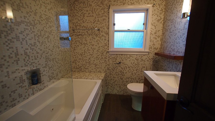 Welcome to a fully glass tiled bathroom